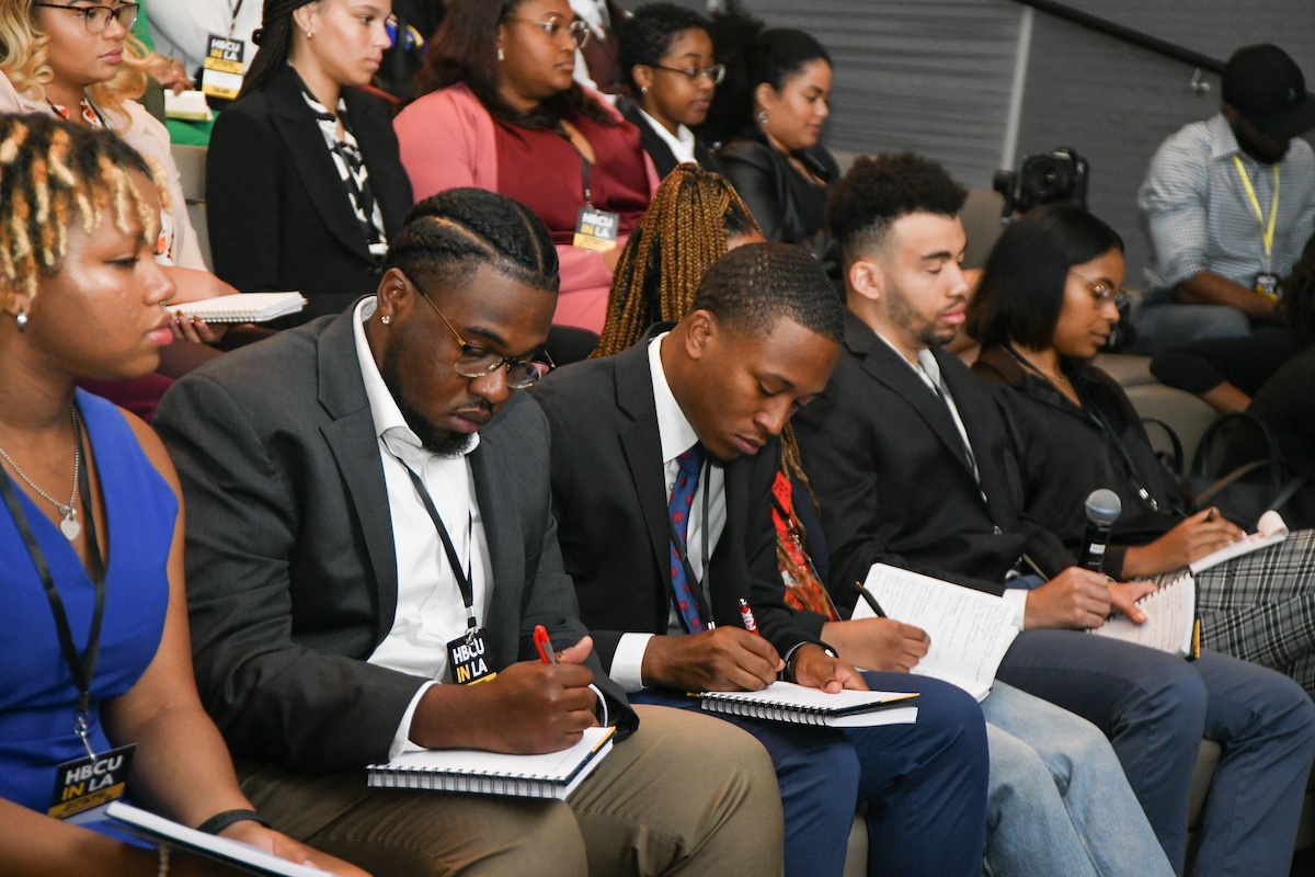 EICOP students taking notes during a campus visit
